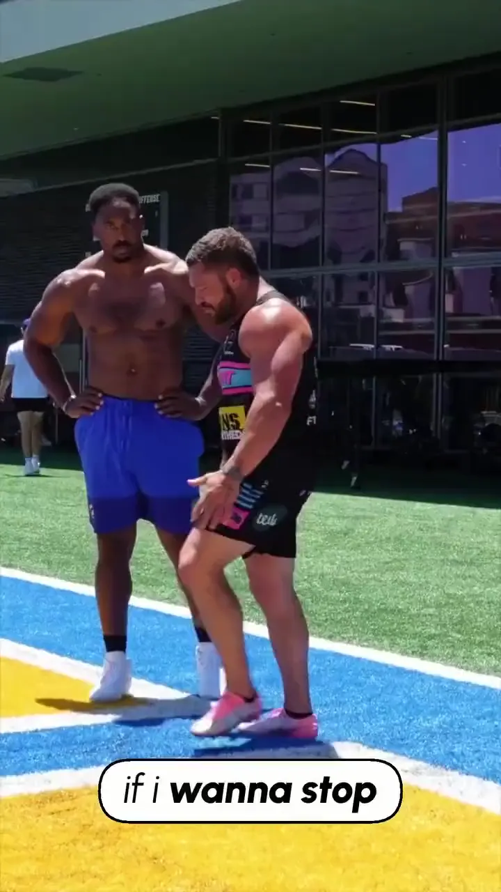 Billy coaching Myles Garrett on a UCLA field, the first frame of his reel: if i wanna stop.
