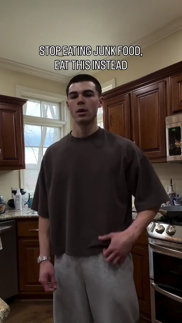 Easton in his kitchen, the first frame of his pancakes reel: stop eating junk food, eat this instead.