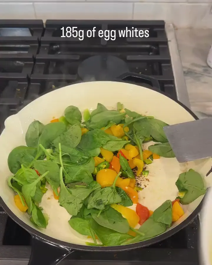 185g of egg whites poured into the pan, over spinach.