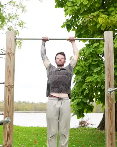Lenny’s strict muscle up on a bar by the lake.
