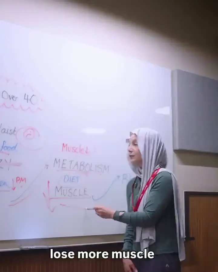 Najah at her whiteboard, BUILD written in red marker, from her reel on her building programme.
